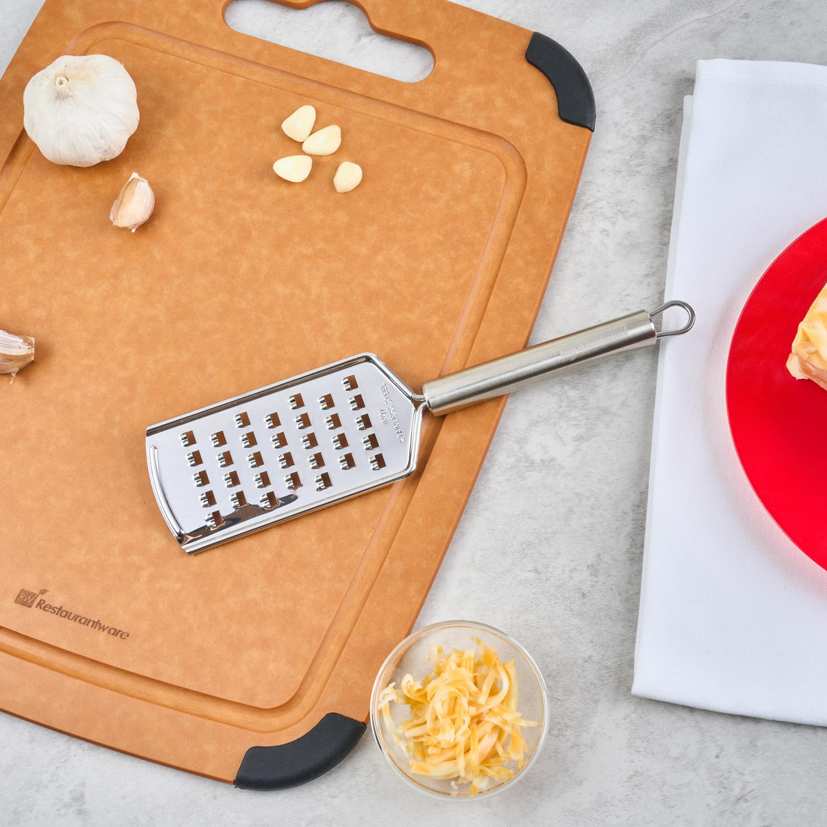 Restaurantware Stainless Steel Coarse Cheese Grater - German Standard Lemon Zester with Ergonomic Handle, Sharp Blades, Dishwasher Safe - Handheld Kitchen Grater for Parmesan, Garlic, Ginger